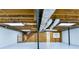 Unfinished basement space with exposed wood beams, ductwork, and painted walls at 3421 Fawn Trl, Marietta, GA 30066