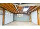 Unfinished basement featuring a garage door and utility access at 3421 Fawn Trl, Marietta, GA 30066