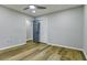 A bright bedroom features modern flooring, fresh paint, and a ceiling fan with light at 3421 Fawn Trl, Marietta, GA 30066