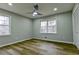 A sunlit bedroom boasts sleek hardwood floors and modern ceiling fan at 3421 Fawn Trl, Marietta, GA 30066