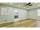 A bright bedroom with light gray paint boasts recessed lighting and wood floors at 3421 Fawn Trl, Marietta, GA 30066