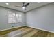 Bedroom with wood-look flooring, neutral paint and a window for natural light at 3421 Fawn Trl, Marietta, GA 30066