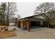 Exterior view of the brick home with a well-maintained carport and landscaping at 3421 Fawn Trl, Marietta, GA 30066