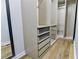 Spacious closet with custom shelving, drawers, and wood-look flooring, offering ample storage and organization at 3421 Fawn Trl, Marietta, GA 30066