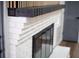 Close up view of black and white fireplace with modern accents at 3421 Fawn Trl, Marietta, GA 30066