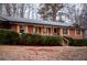 Charming brick home featuring shutters, mature landscaping and inviting entryway at 3421 Fawn Trl, Marietta, GA 30066