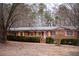 Charming brick home featuring shutters, mature landscaping and inviting entryway at 3421 Fawn Trl, Marietta, GA 30066