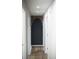 Clean hallway with dark-painted accent wall and wood flooring at 3421 Fawn Trl, Marietta, GA 30066