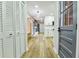Open hallway with hardwood floors and modern doors leading to the kitchen and living areas at 3421 Fawn Trl, Marietta, GA 30066