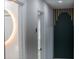 Hallway featuring modern fixtures and leading to a bathroom with illuminated mirror at 3421 Fawn Trl, Marietta, GA 30066