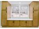 New kitchen cabinets surround the window and have black matte handles at 3421 Fawn Trl, Marietta, GA 30066