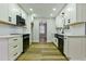 Modern kitchen with white cabinets, updated appliances, and subway tile backsplash at 3421 Fawn Trl, Marietta, GA 30066
