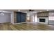 Spacious living room with hardwood floors, fireplace, and modern barn doors at 3421 Fawn Trl, Marietta, GA 30066