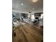 Open-concept living room with modern furnishings, fireplace, and hardwood floors at 3421 Fawn Trl, Marietta, GA 30066