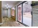 Hallway with built-in cabinets leading to an outdoor patio with brick accents and natural views at 3421 Fawn Trl, Marietta, GA 30066