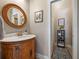 Vanity with marble countertop and open shower at 4248 Hog Mountain Rd, Hoschton, GA 30548