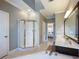 Bathroom with walk-in shower and double vanity at 4248 Hog Mountain Rd, Hoschton, GA 30548