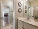 Bright bathroom with vanity and access to bedroom and hallway at 4248 Hog Mountain Rd, Hoschton, GA 30548