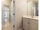Simple bathroom with vanity, mirror and access to hallway at 4248 Hog Mountain Rd, Hoschton, GA 30548