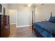 Serene bedroom with a king-size bed and hardwood floors at 4248 Hog Mountain Rd, Hoschton, GA 30548