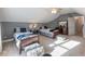 Spacious bedroom with two twin beds, ample sunlight, and a ceiling fan at 4248 Hog Mountain Rd, Hoschton, GA 30548