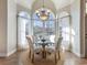 Breakfast nook with arched windows and a chandelier at 4248 Hog Mountain Rd, Hoschton, GA 30548
