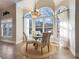 Bright breakfast nook with a glass table and natural light at 4248 Hog Mountain Rd, Hoschton, GA 30548