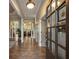 Bright entryway with hardwood floors and a view into the living room at 4248 Hog Mountain Rd, Hoschton, GA 30548