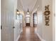 Hardwood floor entryway with dark wood door and home decor at 4248 Hog Mountain Rd, Hoschton, GA 30548