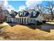 Gray sided two story house with a large front yard at 4248 Hog Mountain Rd, Hoschton, GA 30548