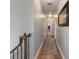 Upstairs hallway with hardwood floors and carpet runner at 4248 Hog Mountain Rd, Hoschton, GA 30548