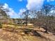 Charming house nestled on a spacious lot with mature trees at 4248 Hog Mountain Rd, Hoschton, GA 30548