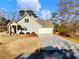 House exterior showcasing front porch and driveway at 4248 Hog Mountain Rd, Hoschton, GA 30548
