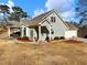 House exterior with front porch and attached garage at 4248 Hog Mountain Rd, Hoschton, GA 30548