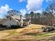 Ranch style home with backyard and firepit at 4248 Hog Mountain Rd, Hoschton, GA 30548