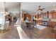 Open concept kitchen with island and hardwood floors at 4248 Hog Mountain Rd, Hoschton, GA 30548