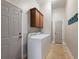 Laundry room with washer, dryer, and extra storage at 4248 Hog Mountain Rd, Hoschton, GA 30548