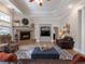 Spacious living area featuring a fireplace and built-in shelving at 4248 Hog Mountain Rd, Hoschton, GA 30548