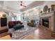 Spacious living room featuring a fireplace and hardwood floors at 4248 Hog Mountain Rd, Hoschton, GA 30548