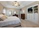 Main bedroom with built-in shelving and access to bathroom at 4248 Hog Mountain Rd, Hoschton, GA 30548