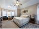Spacious main bedroom with sitting area and large windows at 4248 Hog Mountain Rd, Hoschton, GA 30548