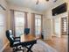 Bright office space with wood desk and window views at 4248 Hog Mountain Rd, Hoschton, GA 30548