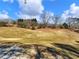 Open pastureland with a distant view of trees and a cell tower at 4248 Hog Mountain Rd, Hoschton, GA 30548
