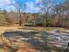 Expansive pasture with a small structure and wooden fence at 4248 Hog Mountain Rd, Hoschton, GA 30548