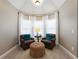 Cozy sitting area with two armchairs and ottoman at 4248 Hog Mountain Rd, Hoschton, GA 30548