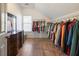 Large walk-in closet with ample hanging space and shelving at 4248 Hog Mountain Rd, Hoschton, GA 30548