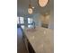 Kitchen island with white quartz countertop and modern sink at 130 Chiswick Cir, Alpharetta, GA 30009