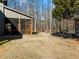 Large backyard with spacious grassy area and trees at 4258 Hog Mountain Rd, Hoschton, GA 30548