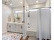 Modern bathroom with a soaking tub, shower, and double vanity at 4258 Hog Mountain Rd, Hoschton, GA 30548