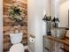 Rustic-style powder room with a unique sink and pallet wall at 4258 Hog Mountain Rd, Hoschton, GA 30548